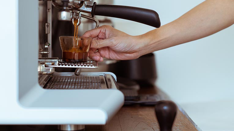 Coffee shots being poured from espresso machine