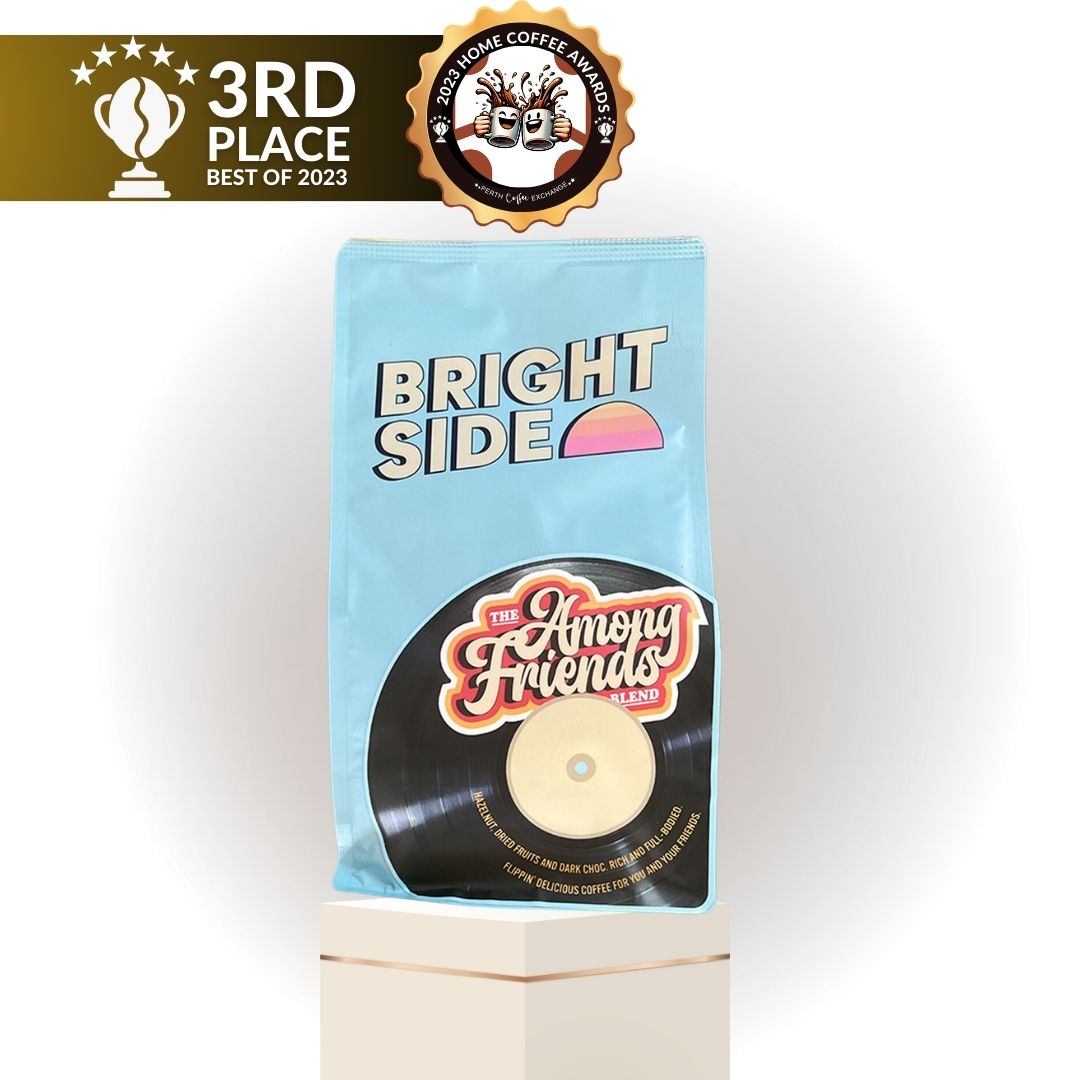BrightSide Among Friends  coffee wins 3rd Place in theA bag of Perth "Bright Side" coffee from The Among Friends blend, designed with a vinyl record graphic, displayed on a pedestal and labeled as "3rd place – Best of 2023" by Perth Coffee Exchange. Best of 2023 Home Coffee Awards at Perth Coffee Exchange