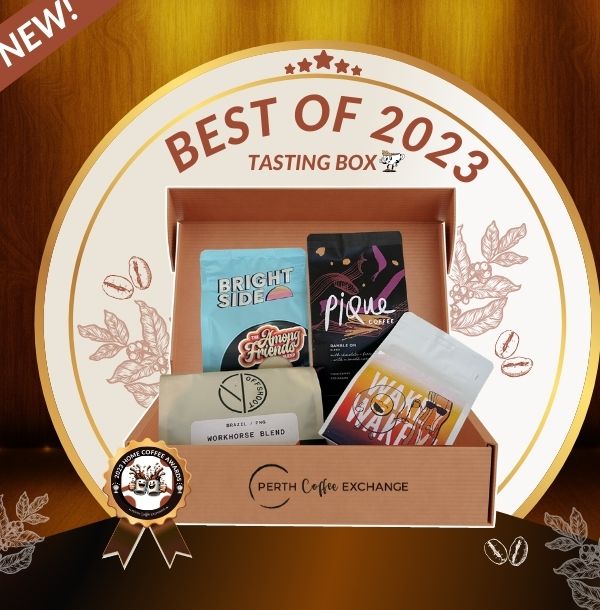 An image featuring the "Best of 2023 Tasting box" from Perth Coffee Exchange, with various coffee packages inside a box surrounded by decorative leaves, highlighting brands like Bright Side, Pique, Offshoot, and Obison.