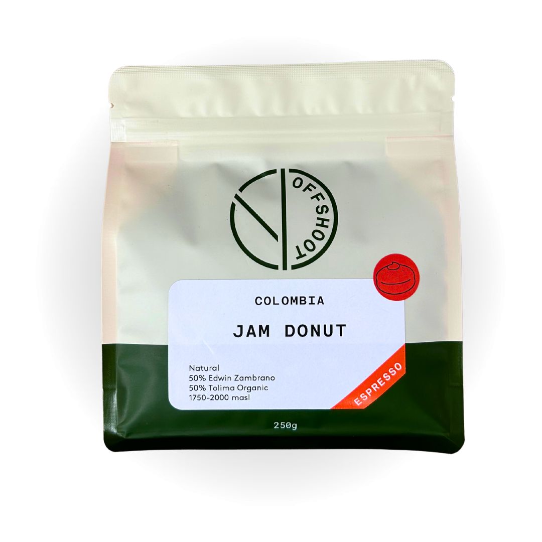 Offshoot's Jam Donut coffee bag from Colombia, showcasing a natural blend of Edwin Zambrano and Tolima Organic beans, with a unique espresso flavor profile highlighted on a green and white minimalist package available at Perth Coffee Exchange
