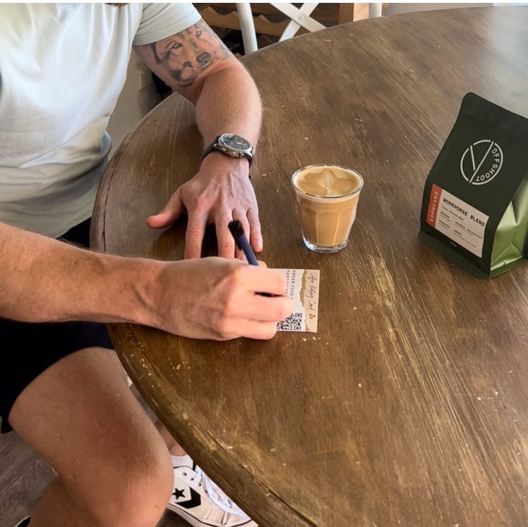 Man Tasting a freshly brewed coffee made from locally roasted coffee beans received in a subscription box